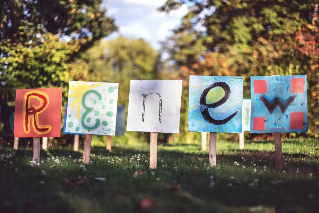 A photo of a sign that reads "Renew" in the yard